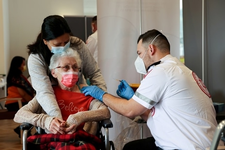 An elderly woman receives a booster shot of her vaccination against the coronavirus disease (COVID-19) at an assisted living facility, in Netanya, Israel(REUTERS)