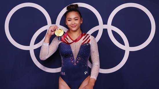 Tokyo 2020 Olympics - Gymnastics - Artistic - Women's Individual All-Around - Medal Ceremony - Ariake Gymnastics Centre, Tokyo, Japan - July 29, 2021. Gold medallist Sunisa Lee of the United States poses with her medal in front of the olympic rings REUTERS/Lindsey Wasson(REUTERS)