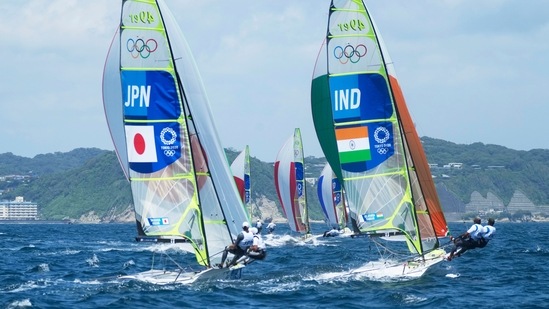 Japan's Leo Takahashi, Ibuki Koizumi, left, and India's Varun Thakkar and Ganapathy Kelapanda compete during the men's 49er class at the 2020 Summer Olympics, Thursday, July 29, 2021, in Fujisawa, Japan. (AP Photo/Gregorio Borgia)(AP)
