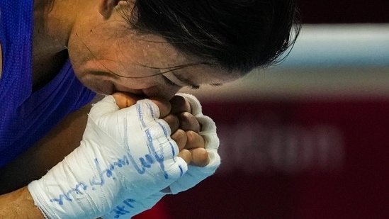 Tokyo: India's Mary Kom reacts after losing her bout to Ingrit Valencia of Columbia in women's Fly (48-51kg) boxing Round of 16, at the Summer Olympics 2020 in Tokyo, Thursday, July 29, 2021. Kom lost the match via split decision. (PTI Photo/Gurinder Osan) (PTI07_29_2021_000275B)(PTI)