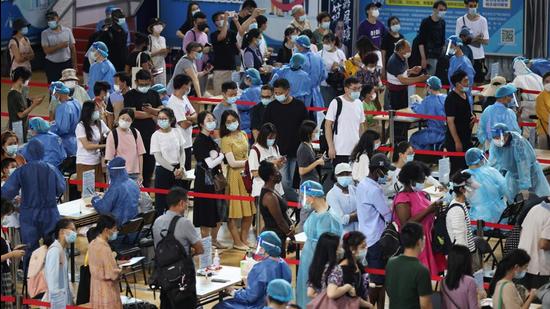 People line up for nucleic acid testing at a sports centre in Gulou district, during a citywide mass testing following new cases of the coronavirus disease in Nanjing, Jiangsu province, China. (REUTERS)