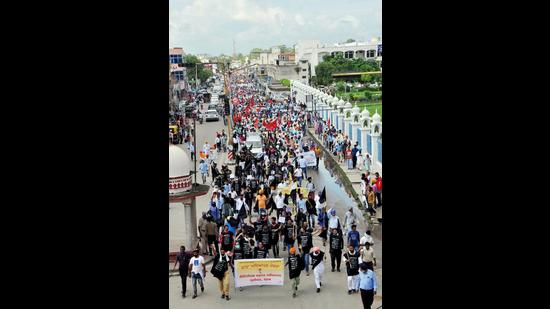 Members of the Punjab-UT Employees and Pensioners Joint Front during a protest march in Patiala.