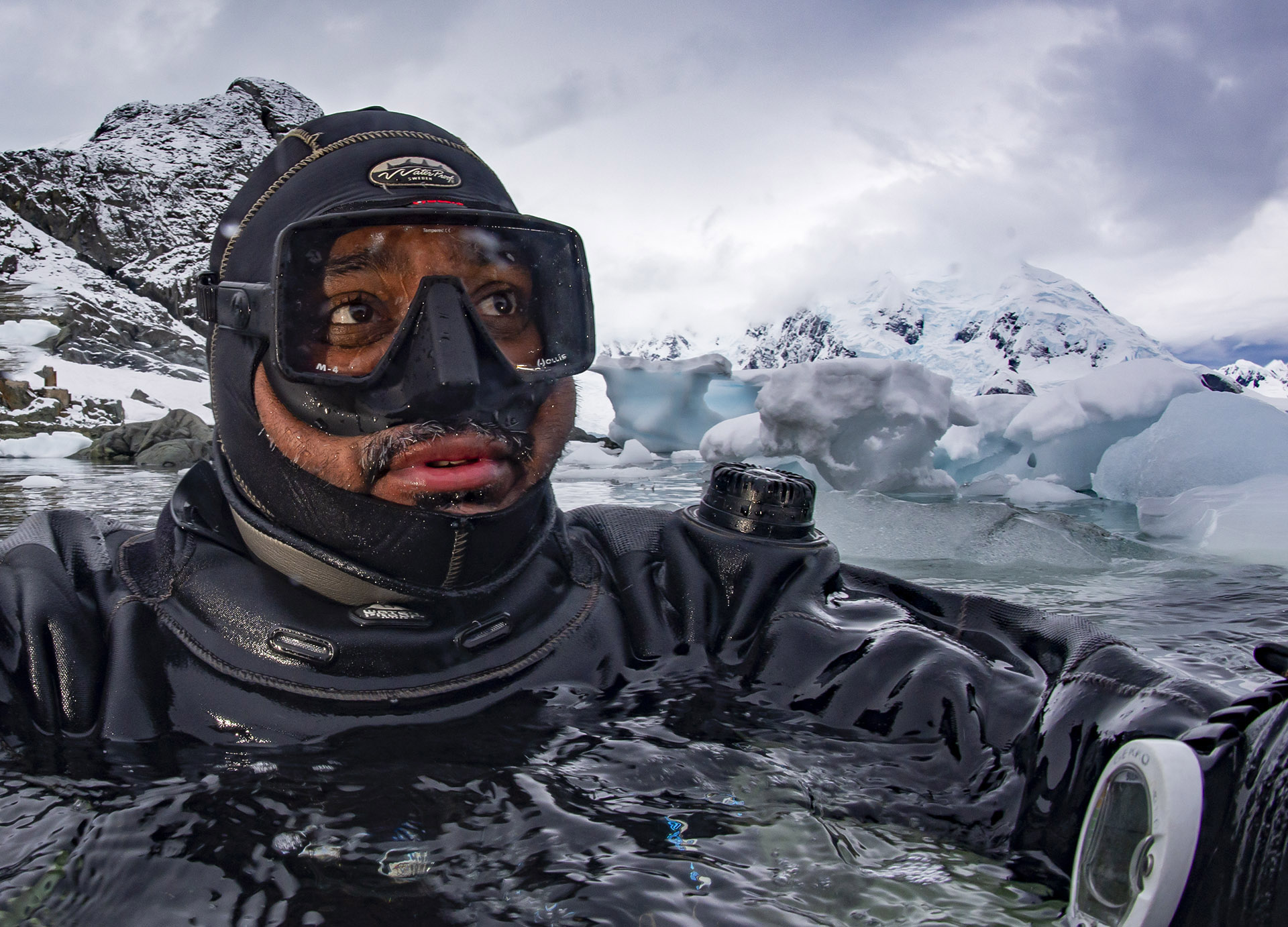 Dhritiman Mukherjee, 46, a photographer from Kolkata, dives beneath the ice, in the ocean around Antarctica. Divers descend through a hole, with a tether around their waists. The tether is their only link to the surface. “If I lose the rope, there would be really very little chance of me finding my way back to the hole, under that vast expanse of ice,” Mukherjee says. Dhritiman Mukherjee, 46, a photographer from Kolkata, dives beneath the ice, in the ocean around Antarctica. Divers descend through a hole, with a tether around their waists. The tether is their only link to the surface. “If I lose the rope, there would be really very little chance of me finding my way back to the hole, under that vast expanse of ice,” Mukherjee says.