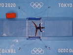 Simone Biles of the United States in action on the uneven bars during the Tokyo 2020 Olympics on July 25(Fabrizio Bensch / REUTERS)