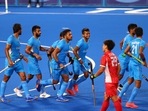 Harmanpreet Singh of India celebrates with teammates after scoring