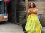 The image shows a singer singing for the 88-year-old woman on her birthday.