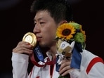 Ma Long of Team China poses with his medal. 