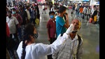 A BMC health worker collects swab samples for Covid-19 test of passengers arriving from outstation trains at CSMT station, in Mumbai on July 14, 2021. (HT PHOTO) A BMC health worker collects swab samples for Covid-19 test of passengers arriving from outstation trains at CSMT station, in Mumbai on July 14, 2021. (HT PHOTO)
