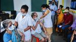 Health workers administer Covid-19 vaccine dose to senior citizens at a school-turned-vaccination centre in Thane on July 7. (PTI) Health workers administer Covid-19 vaccine dose to senior citizens at a school-turned-vaccination centre in Thane on July 7. (PTI)