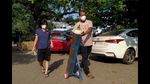 A couple walks with an oxygen cylinder for a Covid-19 patient admitted at GMCH on May 11, 2021. (AFP) A couple walks with an oxygen cylinder for a Covid-19 patient admitted at GMCH on May 11, 2021. (AFP)