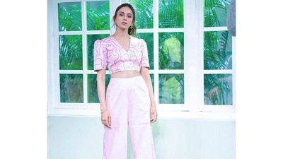She matched this with pink pants and strappy heels. Rakul had her hair up in a pony tail, with a few tendrils framing her face. (Instagram) She matched this with pink pants and strappy heels. Rakul had her hair up in a pony tail, with a few tendrils framing her face. (Instagram)