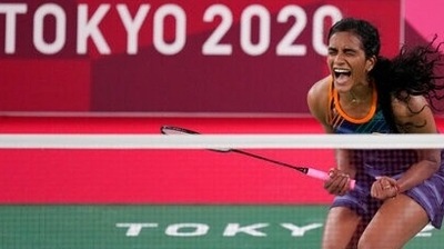 India's PV Sindhu celebrates after wining against Japan's Akane Yamaguchi during their women's singles badminton quarterfinal match at the 2020 Summer Olympics, Friday, July 30, 2021, in Tokyo, Japan. (AP)