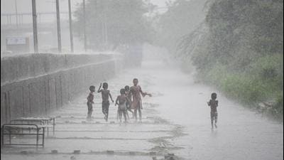 New Delhi, India - July 30, 2021: Children out in the rain at Shastri Park in New Delhi, India, on Friday, July 30, 2021. (Photo by Sanchit Khanna/ Hindustan Times) (Sanchit Khanna/HT PHOTO) New Delhi, India - July 30, 2021: Children out in the rain at Shastri Park in New Delhi, India, on Friday, July 30, 2021. (Photo by Sanchit Khanna/ Hindustan Times) (Sanchit Khanna/HT PHOTO)