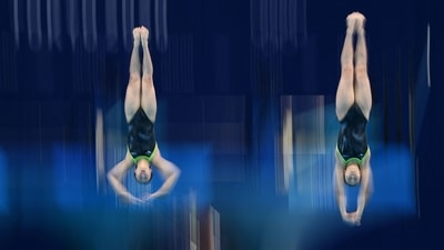 Japan's Hazuki Miyamoto and Japan's Haruka Enomoto compete in the women's synchronised 3m springboard diving final event during the Tokyo 2020 Olympic Games at the Tokyo Aquatics Centre in Tokyo on July 25. (Jonathan Nackstrand / AFP) Japan's Hazuki Miyamoto and Japan's Haruka Enomoto compete in the women's synchronised 3m springboard diving final event during the Tokyo 2020 Olympic Games at the Tokyo Aquatics Centre in Tokyo on July 25. (Jonathan Nackstrand / AFP)