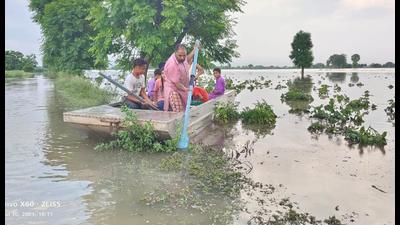 A farmer uses a boat in his submerged fields in Moonak on Friday. (HT Photo) A farmer uses a boat in his submerged fields in Moonak on Friday. (HT Photo)