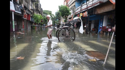 A handpulled rickshaw puller waits for commuters on a waterlogged street in Kolkata on Friday. (Samir Jana/HT Photo) A handpulled rickshaw puller waits for commuters on a waterlogged street in Kolkata on Friday. (Samir Jana/HT Photo)