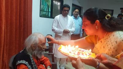 Tilak applied on the forehead of Babasaheb Purandare on his 99th birthday as Raj Thackeray looks on, on Thursday. (HT) Tilak applied on the forehead of Babasaheb Purandare on his 99th birthday as Raj Thackeray looks on, on Thursday. (HT)