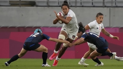 Jordan Matyas of the United States tries to break through Japan's Honoka Tsutsumi, left, and Japan's Mifuyu Koide in their women's rugby sevens match at the 2020 Summer Olympics, Thursday, July 29 in Tokyo. (Shuji Kajiyama / AP) Jordan Matyas of the United States tries to break through Japan's Honoka Tsutsumi, left, and Japan's Mifuyu Koide in their women's rugby sevens match at the 2020 Summer Olympics, Thursday, July 29 in Tokyo. (Shuji Kajiyama / AP)