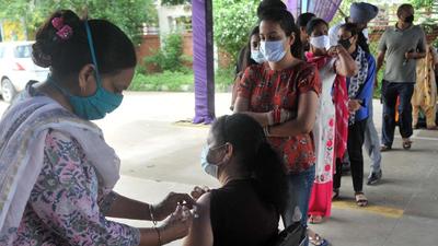 A health worker administering Covid vaccine to a resident at a special vaccination camp at the sports stadium in Mohali’s Sector 78 on Friday. (Ravi Kumar/HT) A health worker administering Covid vaccine to a resident at a special vaccination camp at the sports stadium in Mohali’s Sector 78 on Friday. (Ravi Kumar/HT)