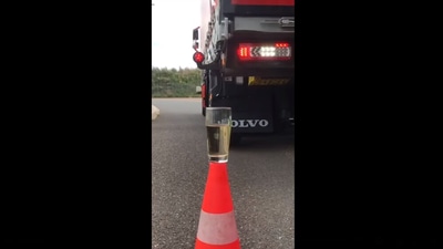 The image is taken from the video that shows a driver dunking a teabag into a glass of water using his truck. (Facebook/@Johan Groteboer)