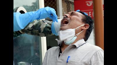 A medical worker collects the swab sample for the Covid-19 test at Ram Manohar Lohia Hospital in Lucknow (ANI file photo)
