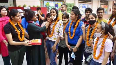 Teachers congratulating Class 12 students in Amritsar after the board exam results were announced on Friday. (Sameer Sehgal/HT) Teachers congratulating Class 12 students in Amritsar after the board exam results were announced on Friday. (Sameer Sehgal/HT)