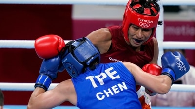 Lovlina Borgohain delivers a punch to Nien-Chin Chen at the Tokyo Olympics 2020 (AP) Lovlina Borgohain delivers a punch to Nien-Chin Chen at the Tokyo Olympics 2020 (AP)
