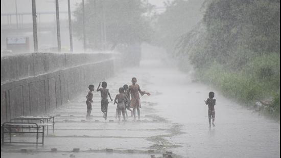 New Delhi, India - July 30, 2021: Children out in the rain at Shastri Park in New Delhi, India, on Friday, July 30, 2021. (Photo by Sanchit Khanna/ Hindustan Times) (Sanchit Khanna/HT PHOTO) New Delhi, India - July 30, 2021: Children out in the rain at Shastri Park in New Delhi, India, on Friday, July 30, 2021. (Photo by Sanchit Khanna/ Hindustan Times) (Sanchit Khanna/HT PHOTO)