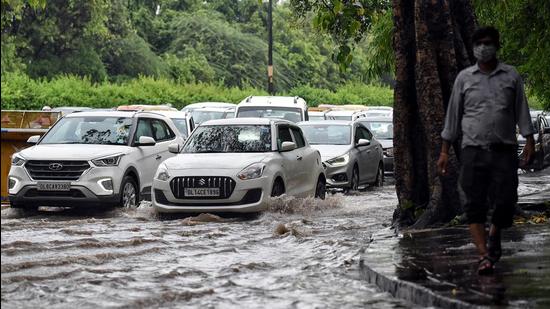 Vehicles wade through a waterlogged road after heavy rainfall near ISBT, in New Delhi on Thursday, July 29. (ANI)