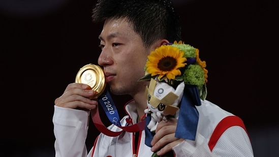 For the fourth straight Olympics, Chinese men have swept the table tennis gold and silver medals in singles. Ma Long defended his Olympic title on Friday by beating teammate and top-ranked player Fan Zhendong 11-4, 10-12, 11-8, 11-9, 3-11, 11-7. (Getty Images)
