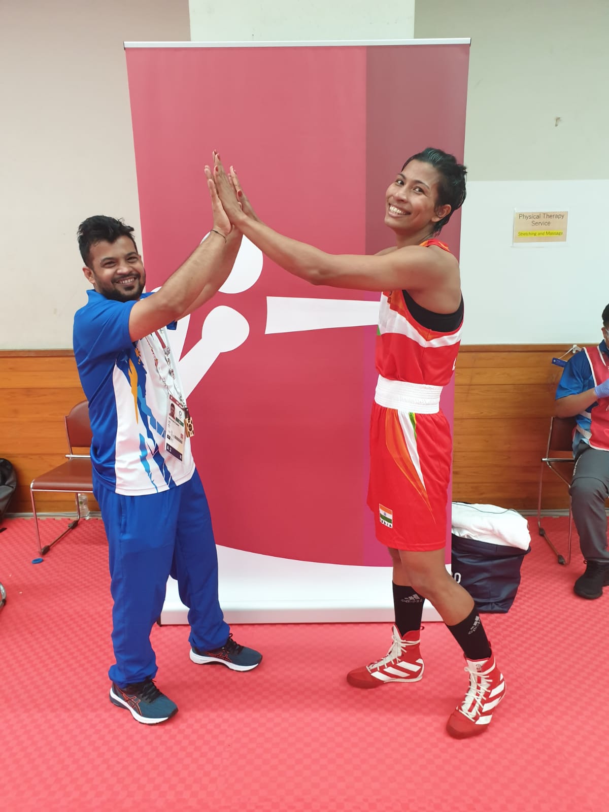 Lovlina Borgohain with coach Md Ali Qamar after the win