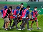 Medics carry away on a stretcher Connor Fields of the United States after he crashed at the first bend in the men's BMX Racing semifinals at the 2020 Summer Olympics.