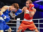 File photo of India's Amit Panghal (R), who was knocked out from Tokyo Olympics