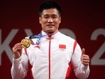 Xiaojun Lyu of China poses with the gold medal. 