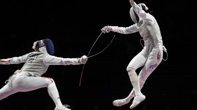 Inna Deriglazova of the Russian Olympic Committee in action against Alice Volpi of Italy during the Fencing Women's Individual Foil Semifinal at Makuhari Messe Hall B in Chiba on July 25. (Annegret Hilse / REUTERS) Inna Deriglazova of the Russian Olympic Committee in action against Alice Volpi of Italy during the Fencing Women's Individual Foil Semifinal at Makuhari Messe Hall B in Chiba on July 25. (Annegret Hilse / REUTERS)