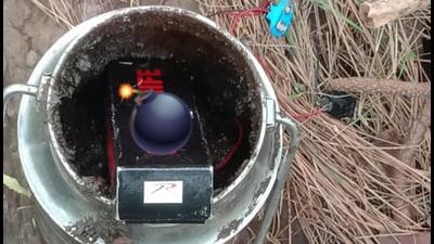 A powerful IED concealed in a milk can kept along the Jammu-Rajouri-Poonch national highway. (HT PHOTO)