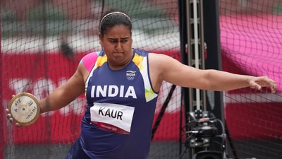 Kamalpreet Kaur, of India, competes during the qualification round of the women's discus throw at the 2020 Summer Olympics, Saturday. (AP) Kamalpreet Kaur, of India, competes during the qualification round of the women's discus throw at the 2020 Summer Olympics, Saturday. (AP)