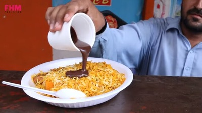 The image shows the biryani and chocolate dish being prepared. (YouTube/@FHM Pakistan)