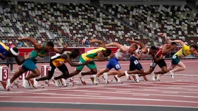 Competitors start in their heat of the men's 100-meters with empty seats as a backdrop in the Olympic Stadium at the 2020 Summer Olympics, Saturday, July 31, 2021, in Tokyo. (AP Photo/Jae C. Hong) (AP)