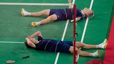 Malaysia's Malaysia's Aaron Chia and Soh Wooi Yik celebrate after winning against Indonesia's Mohammad Ahsan and Hendra Setiawan during their badminton men's doubles bronze medal match at the 2020 Summer Olympics, Saturday, July 31, 2021, in Tokyo, Japan. (AP Photo/Markus Schreiber) (AP)