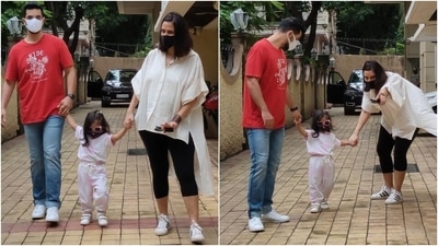 While Neha looked stunning, Angad complemented his wife in a printed T-shirt and denims with white sneakers and a face mask. As for their daughter Mehr, the little munchkin wore co-ord joggers set, funky sunglasses and a face mask. (Varinder Chawla) While Neha looked stunning, Angad complemented his wife in a printed T-shirt and denims with white sneakers and a face mask. As for their daughter Mehr, the little munchkin wore co-ord joggers set, funky sunglasses and a face mask. (Varinder Chawla)