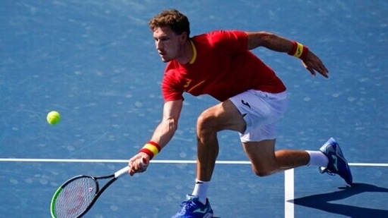 Pablo Carreno Busta, of Spain, returns a shot to Novak Djokovic, of Serbia, during the bronze medal match of the tennis competition at the 2020 Summer Olympics, Saturday, July 31, 2021, in Tokyo, Japan. (AP Photo/Seth Wenig)(AP)
