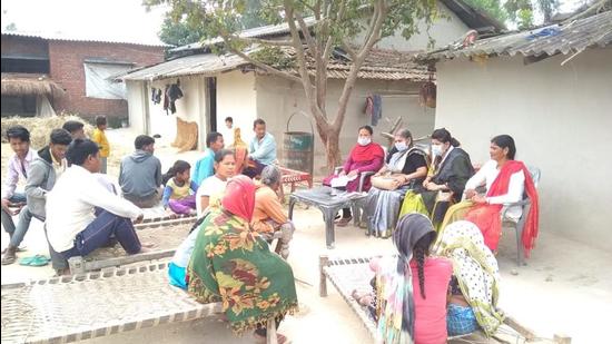 Health workers during a Covid awareness camp and vaccination drive in the Tharu dominated areas of Palia block in Lakhimpur Kheri in UP. (HT Photo)