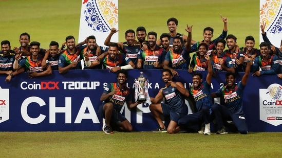 Members of the Sri Lankan team pose with the winners trophy at the end of the third Twenty20 cricket match between Sri Lanka and India. (AP)