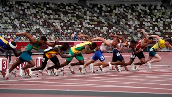 Competitors start in their heat of the men's 100-meters with empty seats as a backdrop in the Olympic Stadium at the 2020 Summer Olympics, Saturday, July 31, 2021, in Tokyo. (AP Photo/Jae C. Hong)(AP)