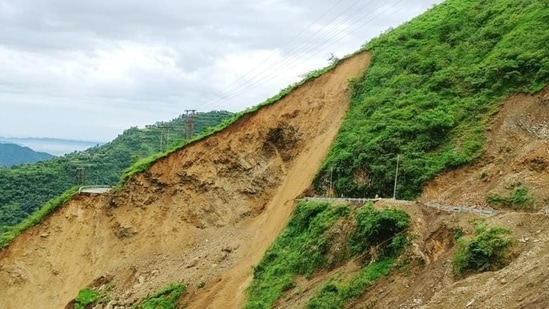 Commuters had a narrow escape when a stretch of national highway (NH) 707 was swept away in a landslide near Barwas in Kamrau tehsil of Sirmaur district on Friday. (HT Photo) Commuters had a narrow escape when a stretch of national highway (NH) 707 was swept away in a landslide near Barwas in Kamrau tehsil of Sirmaur district on Friday. (HT Photo)