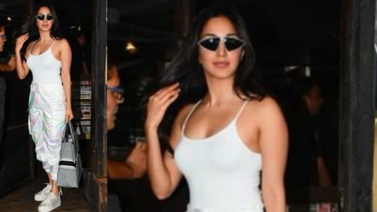 Kiara aced the street-style look as she posed in a white tank top, satin joggers and white sneakers. She accessorised her look with black shades and a checkered tote bag.(Instagram/@kiaraaliaadvani)