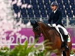 India's Fouaad Mirza, riding Seigneur, competes during the equestrian eventing dressage at Equestrian Park at the 2020 Summer Olympics.