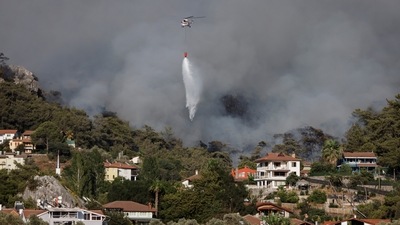 The minister of agriculture and forestry, Bekir Pakdemirli, said Saturday that 91 of the 101 fires that broke out amid strong winds and scorching heat have been brought under control.  (REUTERS/Umit Bektas)
