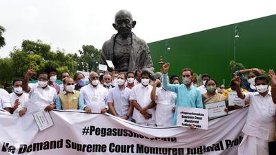 Congress leader Rahul Gandhi with other party leaders stage a protest near Gandhi statue against Pegasus project on July 23. (PTI) Congress leader Rahul Gandhi with other party leaders stage a protest near Gandhi statue against Pegasus project on July 23. (PTI)